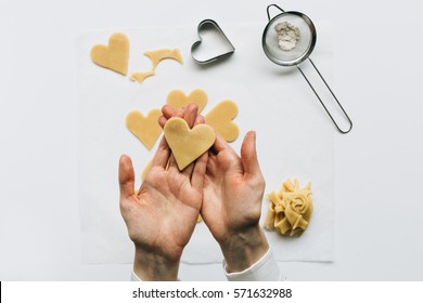 Woman Holding Heart Shaped Cookie Dough In Hands 