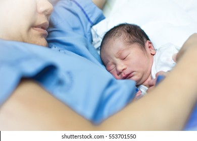 Woman Holding Her 1 Days Old Newborn Baby