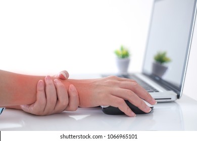 Woman Holding Her Wrist Pain From Using Computer.,Hand Pain