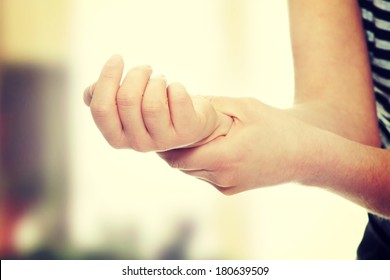 Woman Holding Her Wrist - Pain Concept