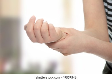 Woman Holding Her Wrist - Pain Concept