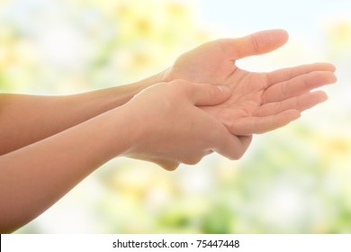 Woman Holding His Hand - Pain Concept