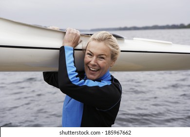 Woman Holding Kayak