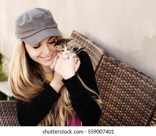 Woman Holding A Kitten