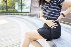 Woman Holding The Left Side Of Her Waist In Pain,painful In The Flank Between Ribs And  Hip,symptoms Of Kidney Infection,acute Pyelonephritis Or Sciatica Pain,piriformis Syndrome,health Care Concept
