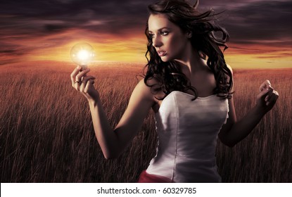 Woman Holding A Light Bulb