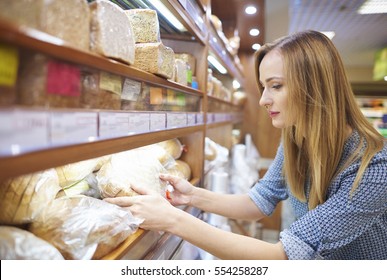 Woman Holding Loaf Of Fresh Bread