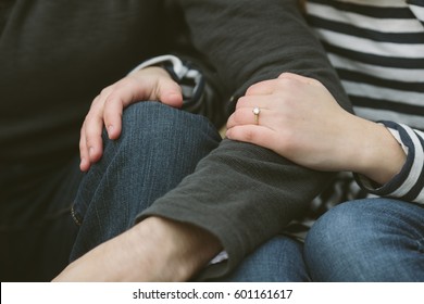 Woman Holding Man's Arm With Ring