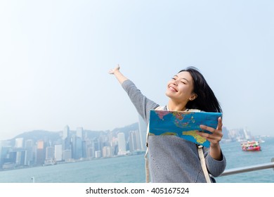 Woman Holding A Map And Hand Raise Up