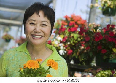 Woman Holding Marigolds