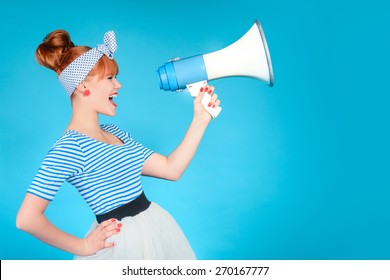 Woman holding a megaphone on blue background  - Powered by Shutterstock