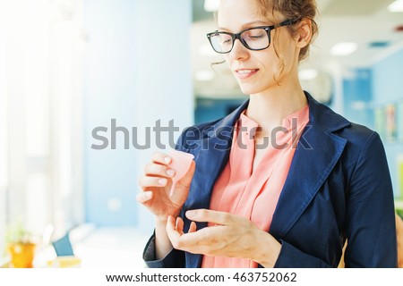 woman holding menstrual cup