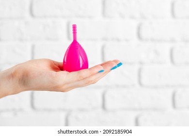 Woman Holding Menstrual Cup In Hand Close Up