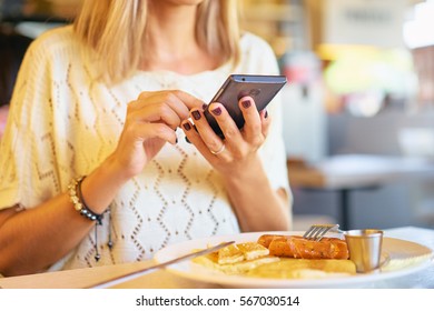 Woman Holding Mobile Phone In Hands, Texting In Social Media. Breakfast Of Business Lady.