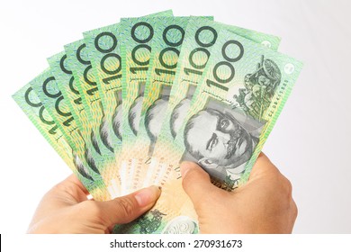 Woman Holding Money - AUD - Australian Dollars