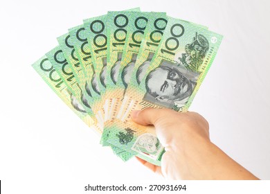 woman holding money - AUD - Australian Dollars