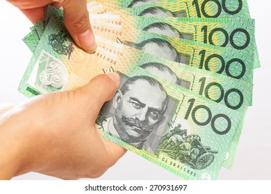 Woman Holding Money - AUD - Australian Dollars