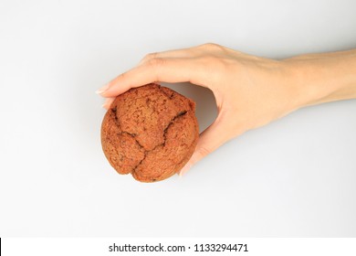 Woman holding muffin cake