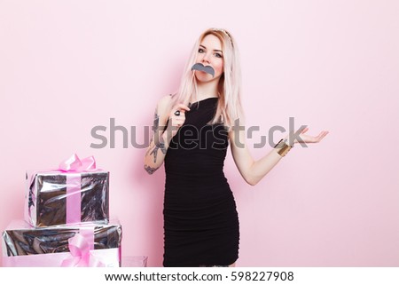 woman holding mustache on stick 