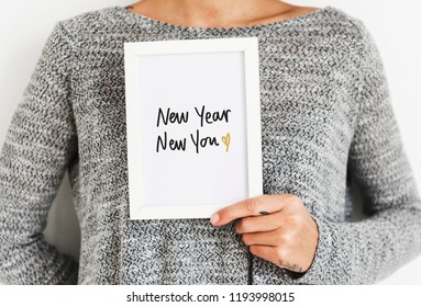 Woman Holding A New Year New You Card