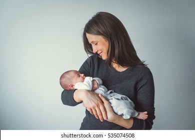 A woman holding a newborn. Mom and baby. Close-up. - Shutterstock ID 535074508
