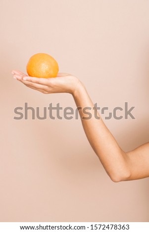 Similar – Image, Stock Photo orange in hand on orange wall