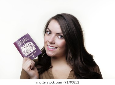 Woman Holding Out A UK Passport In Her Hand