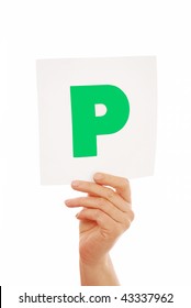 Woman Holding P Plate Sign Over White Isolated Background