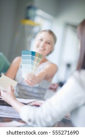 Woman Holding Paint Swatches