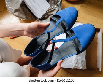 Woman Holding Pair Of New Blue Elegant Leather Shoes Right After Unboxing - POV Point Of View Admiring The Merchandise Shopping Online