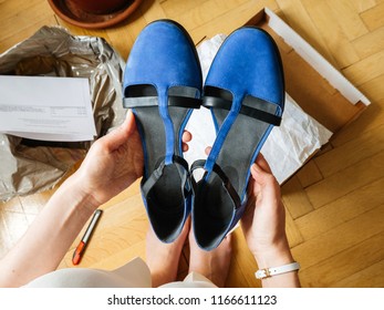 Woman Holding Pair Of New Blue Elegant Shoes Right After Unboxing - POV Point Of View Admiring The Merchandise Shopping Online