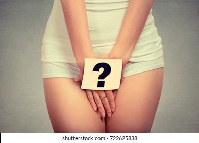 Woman Holding Paper With Question Mark Over Her Crotch. Health Hygiene Sexual Education Concept