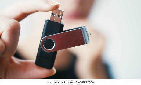 Woman holding a Pen Drive Flash USB Computer Memory Stick