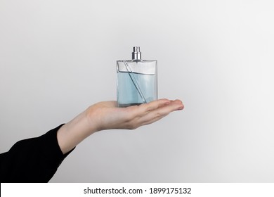 A Woman Is Holding An Perfume. Place For Your Text. The Concept Of Hazardous Substances In Cosmetics And Household Chemicals