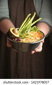 Woman Holding A Pet Bowl With Vegan Food In Hand. Rustic Style. Vertical.