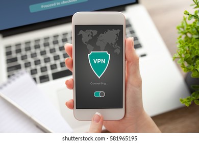 woman holding phone with app vpn creation Internet protocols for protection private network