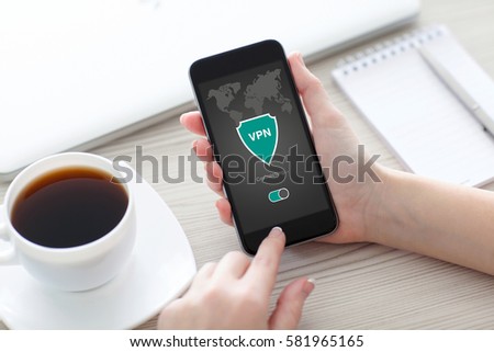 woman holding phone with app vpn creation Internet protocols for protection private network
