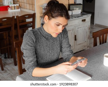 Woman Holding A Phone And Working From Home. Female Business. Lifestyle Authentic Moment