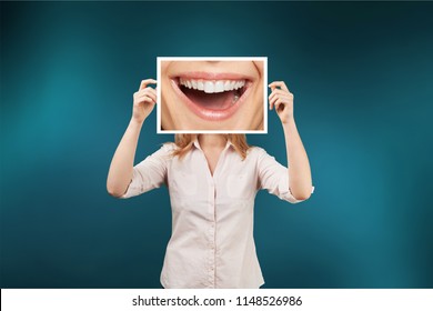 Woman Holding Picture With Big Smile