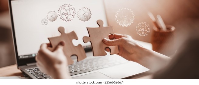 Woman holding pieces of puzzle in the office - Shutterstock ID 2256662667