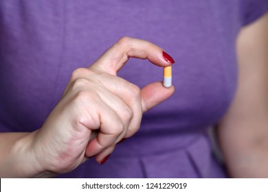 Woman Holding A Pill. Capsule In Female Hand Close-up, Concept Of Pharmacy, Drug Intake, Health Care, Female Viagra Pill