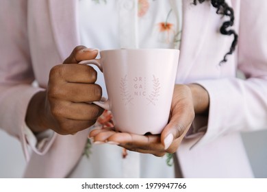 Woman holding a pink mug mockup illustration