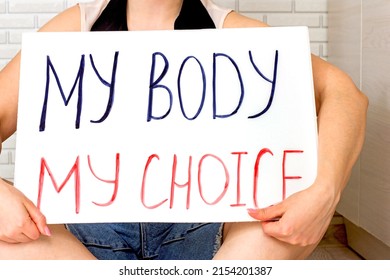 Woman Holding A Placard With My Body My Choice Text. Reproductive Women And Pro-abortion Rights Protest Concept