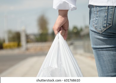 Woman Holding A Plastic Bag