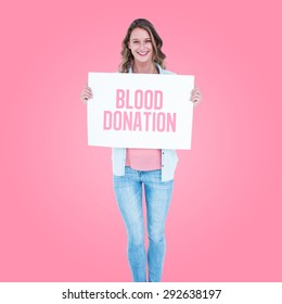 Woman Holding Poster Against Pink