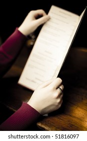 Woman Holding A Pub Menu.