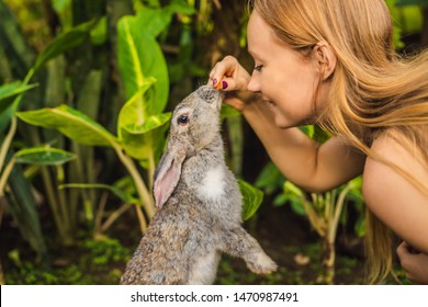 Woman holding a rabbit. Cosmetics test on rabbit animal. Cruelty free and stop animal abuse concept