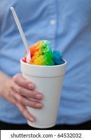 Woman Holding A Rainbow-colored Snow Cone In A Cup