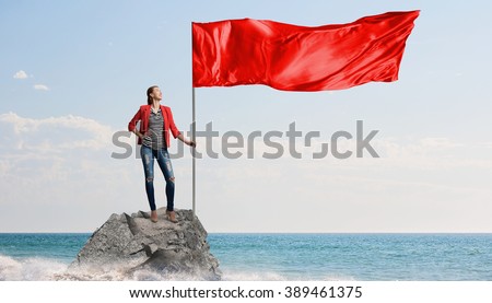 Woman holding red flag