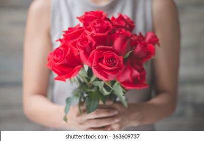 Woman Holding Red Rose